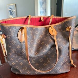Louis Vuitton NeverFull.Brown and Tan Monogram Tote with Red Interior.